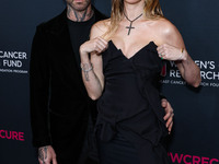 American singer and songwriter Adam Levine of American pop rock band Maroon 5 and wife/Namibian model Behati Prinsloo arrive at The Women's...