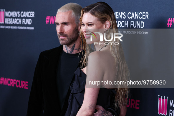 American singer and songwriter Adam Levine of American pop rock band Maroon 5 and wife/Namibian model Behati Prinsloo arrive at The Women's...