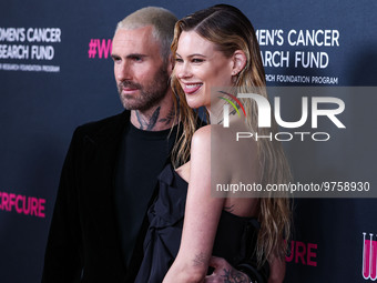 American singer and songwriter Adam Levine of American pop rock band Maroon 5 and wife/Namibian model Behati Prinsloo arrive at The Women's...