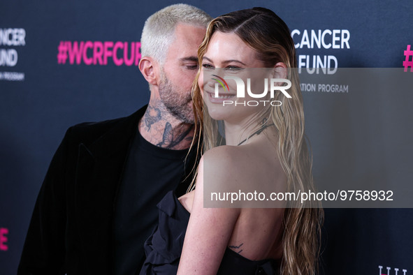 American singer and songwriter Adam Levine of American pop rock band Maroon 5 and wife/Namibian model Behati Prinsloo arrive at The Women's...