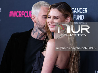 American singer and songwriter Adam Levine of American pop rock band Maroon 5 and wife/Namibian model Behati Prinsloo arrive at The Women's...