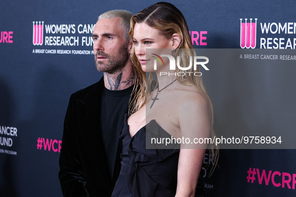 American singer and songwriter Adam Levine of American pop rock band Maroon 5 and wife/Namibian model Behati Prinsloo arrive at The Women's...