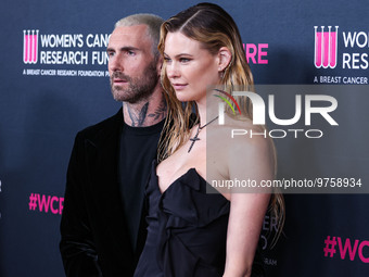 American singer and songwriter Adam Levine of American pop rock band Maroon 5 and wife/Namibian model Behati Prinsloo arrive at The Women's...