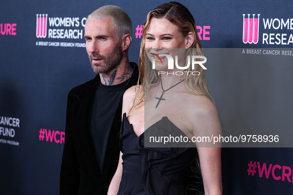 American singer and songwriter Adam Levine of American pop rock band Maroon 5 and wife/Namibian model Behati Prinsloo arrive at The Women's...