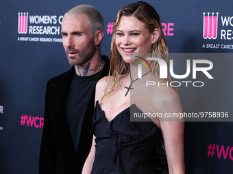 American singer and songwriter Adam Levine of American pop rock band Maroon 5 and wife/Namibian model Behati Prinsloo arrive at The Women's...