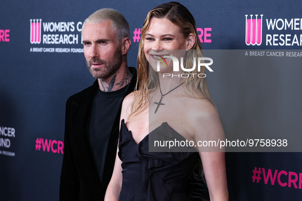 American singer and songwriter Adam Levine of American pop rock band Maroon 5 and wife/Namibian model Behati Prinsloo arrive at The Women's...