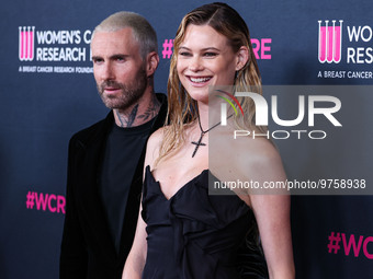 American singer and songwriter Adam Levine of American pop rock band Maroon 5 and wife/Namibian model Behati Prinsloo arrive at The Women's...