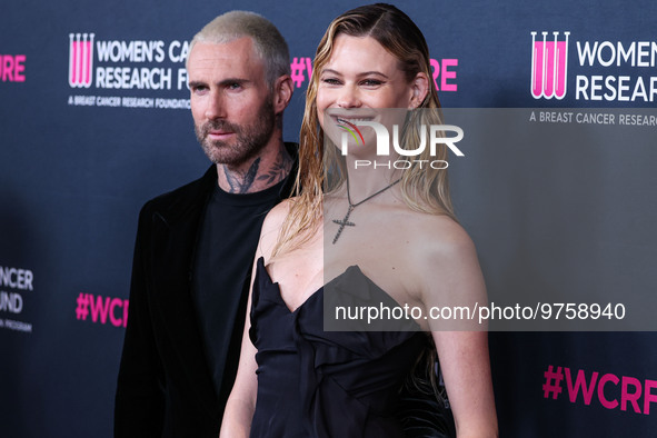 American singer and songwriter Adam Levine of American pop rock band Maroon 5 and wife/Namibian model Behati Prinsloo arrive at The Women's...