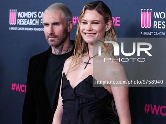 American singer and songwriter Adam Levine of American pop rock band Maroon 5 and wife/Namibian model Behati Prinsloo arrive at The Women's...