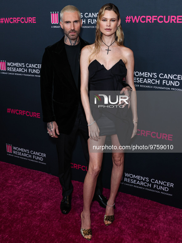 American singer and songwriter Adam Levine of American pop rock band Maroon 5 and wife/Namibian model Behati Prinsloo arrive at The Women's...