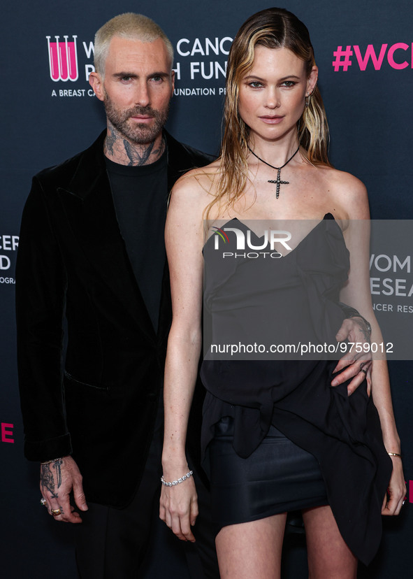 American singer and songwriter Adam Levine of American pop rock band Maroon 5 and wife/Namibian model Behati Prinsloo arrive at The Women's...