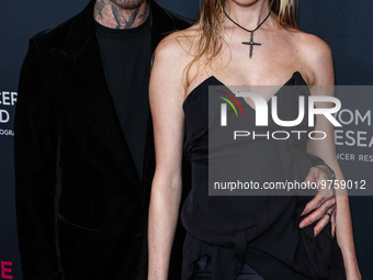 American singer and songwriter Adam Levine of American pop rock band Maroon 5 and wife/Namibian model Behati Prinsloo arrive at The Women's...