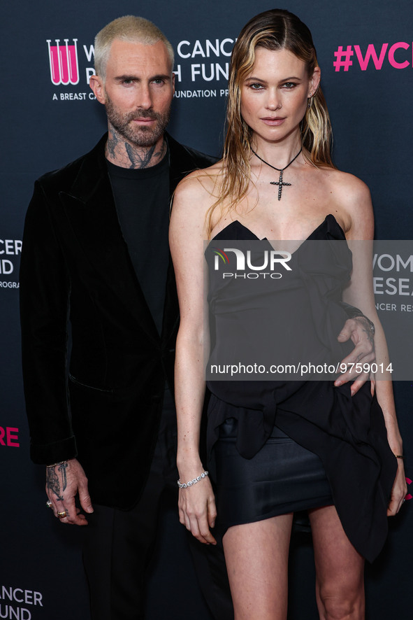 American singer and songwriter Adam Levine of American pop rock band Maroon 5 and wife/Namibian model Behati Prinsloo arrive at The Women's...