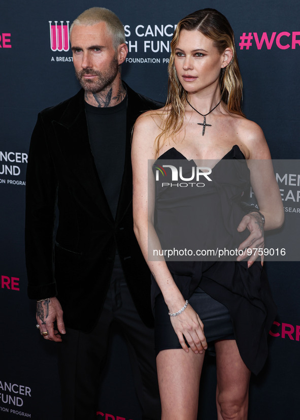 American singer and songwriter Adam Levine of American pop rock band Maroon 5 and wife/Namibian model Behati Prinsloo arrive at The Women's...