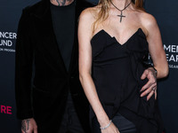 American singer and songwriter Adam Levine of American pop rock band Maroon 5 and wife/Namibian model Behati Prinsloo arrive at The Women's...