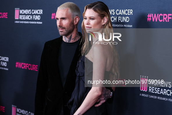 American singer and songwriter Adam Levine of American pop rock band Maroon 5 and wife/Namibian model Behati Prinsloo arrive at The Women's...