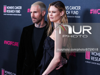 American singer and songwriter Adam Levine of American pop rock band Maroon 5 and wife/Namibian model Behati Prinsloo arrive at The Women's...