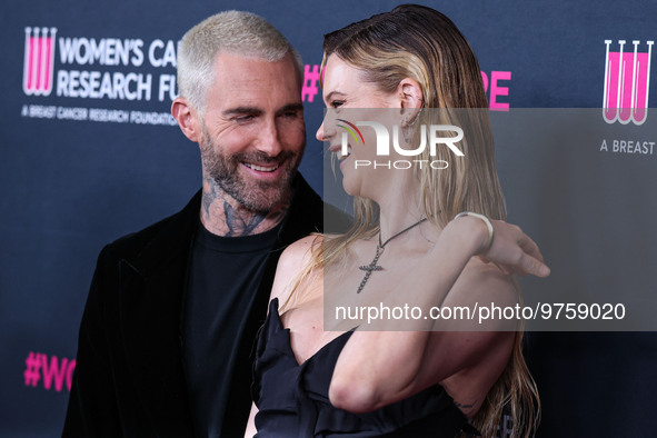 American singer and songwriter Adam Levine of American pop rock band Maroon 5 and wife/Namibian model Behati Prinsloo arrive at The Women's...