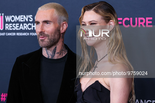 American singer and songwriter Adam Levine of American pop rock band Maroon 5 and wife/Namibian model Behati Prinsloo arrive at The Women's...