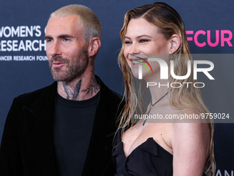 American singer and songwriter Adam Levine of American pop rock band Maroon 5 and wife/Namibian model Behati Prinsloo arrive at The Women's...