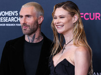 American singer and songwriter Adam Levine of American pop rock band Maroon 5 and wife/Namibian model Behati Prinsloo arrive at The Women's...