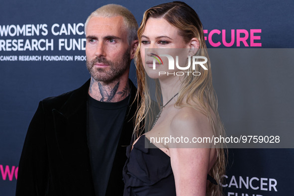 American singer and songwriter Adam Levine of American pop rock band Maroon 5 and wife/Namibian model Behati Prinsloo arrive at The Women's...