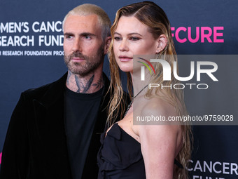 American singer and songwriter Adam Levine of American pop rock band Maroon 5 and wife/Namibian model Behati Prinsloo arrive at The Women's...