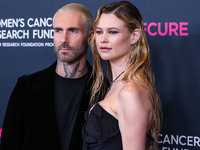 American singer and songwriter Adam Levine of American pop rock band Maroon 5 and wife/Namibian model Behati Prinsloo arrive at The Women's...