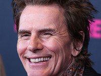 British musician John Taylor of English rock band Duran Duran arrives at The Women's Cancer Research Fund's An Unforgettable Evening Benefit...