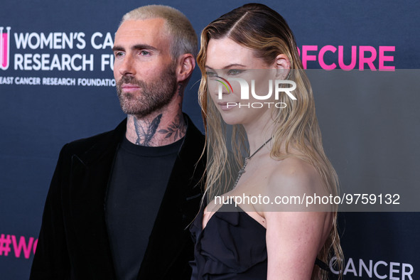 American singer and songwriter Adam Levine of American pop rock band Maroon 5 and wife/Namibian model Behati Prinsloo arrive at The Women's...