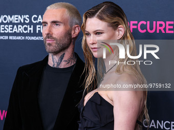 American singer and songwriter Adam Levine of American pop rock band Maroon 5 and wife/Namibian model Behati Prinsloo arrive at The Women's...