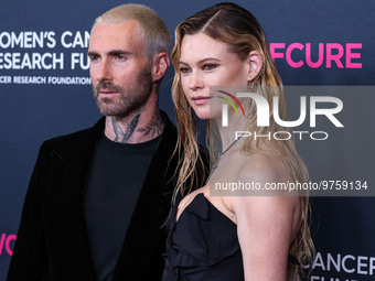 American singer and songwriter Adam Levine of American pop rock band Maroon 5 and wife/Namibian model Behati Prinsloo arrive at The Women's...