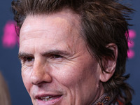 British musician John Taylor of English rock band Duran Duran arrives at The Women's Cancer Research Fund's An Unforgettable Evening Benefit...