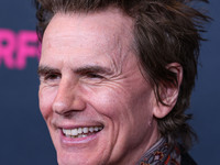 British musician John Taylor of English rock band Duran Duran arrives at The Women's Cancer Research Fund's An Unforgettable Evening Benefit...