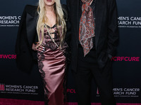 Gela Nash-Taylor and husband/British musician John Taylor of English rock band Duran Duran arrive at The Women's Cancer Research Fund's An U...