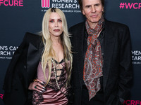 Gela Nash-Taylor and husband/British musician John Taylor of English rock band Duran Duran arrive at The Women's Cancer Research Fund's An U...