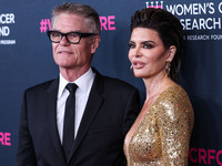 American actor, author and entrepreneur Harry Hamlin and wife/American actress, television personality and model Lisa Rinna arrive at The Wo...