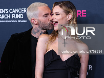 American singer and songwriter Adam Levine of American pop rock band Maroon 5 and wife/Namibian model Behati Prinsloo arrive at The Women's...