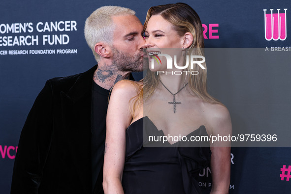 American singer and songwriter Adam Levine of American pop rock band Maroon 5 and wife/Namibian model Behati Prinsloo arrive at The Women's...