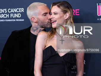 American singer and songwriter Adam Levine of American pop rock band Maroon 5 and wife/Namibian model Behati Prinsloo arrive at The Women's...