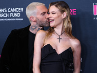 American singer and songwriter Adam Levine of American pop rock band Maroon 5 and wife/Namibian model Behati Prinsloo arrive at The Women's...