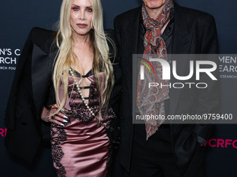 Gela Nash-Taylor and husband/British musician John Taylor of English rock band Duran Duran arrive at The Women's Cancer Research Fund's An U...