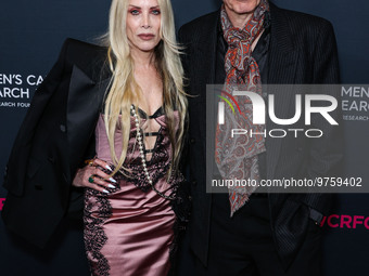 Gela Nash-Taylor and husband/British musician John Taylor of English rock band Duran Duran arrive at The Women's Cancer Research Fund's An U...