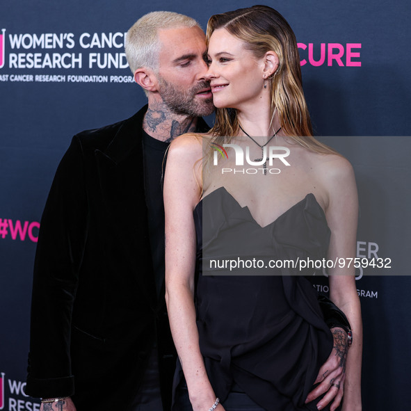 American singer and songwriter Adam Levine of American pop rock band Maroon 5 and wife/Namibian model Behati Prinsloo arrive at The Women's...