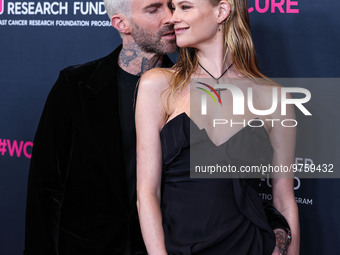 American singer and songwriter Adam Levine of American pop rock band Maroon 5 and wife/Namibian model Behati Prinsloo arrive at The Women's...