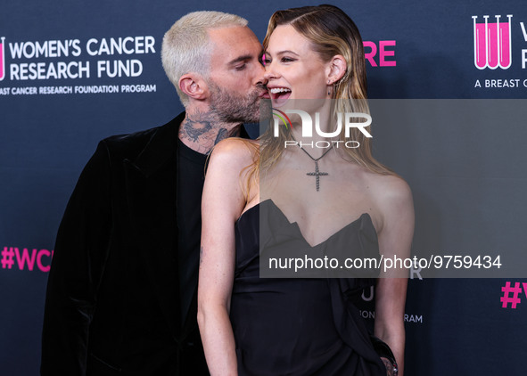 American singer and songwriter Adam Levine of American pop rock band Maroon 5 and wife/Namibian model Behati Prinsloo arrive at The Women's...