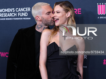 American singer and songwriter Adam Levine of American pop rock band Maroon 5 and wife/Namibian model Behati Prinsloo arrive at The Women's...