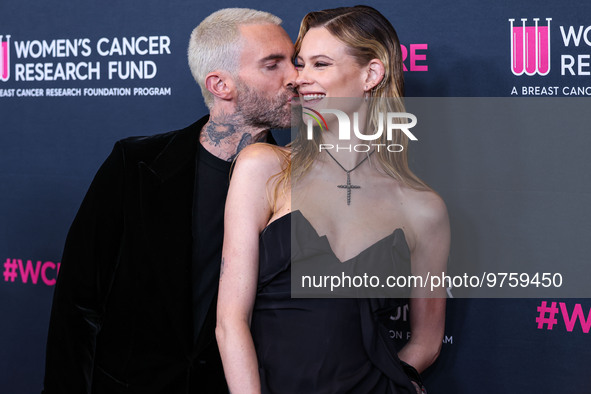 American singer and songwriter Adam Levine of American pop rock band Maroon 5 and wife/Namibian model Behati Prinsloo arrive at The Women's...