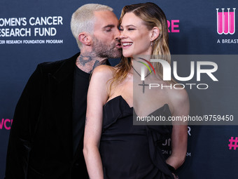 American singer and songwriter Adam Levine of American pop rock band Maroon 5 and wife/Namibian model Behati Prinsloo arrive at The Women's...