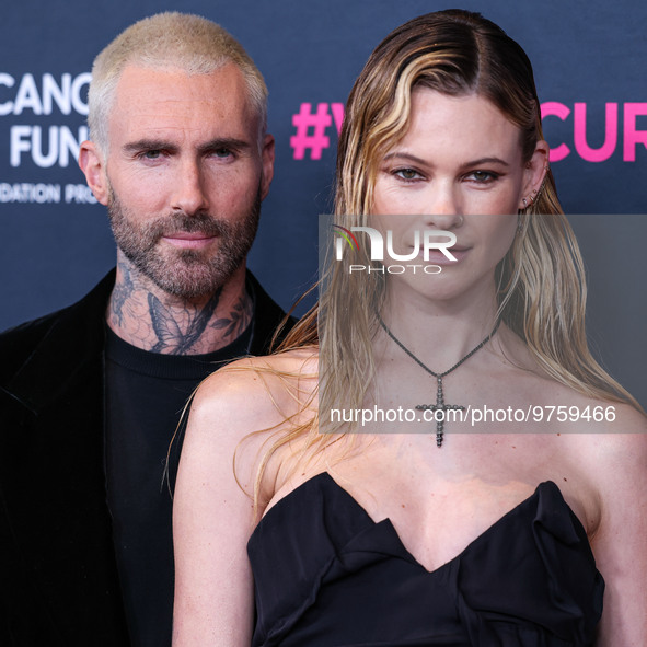 American singer and songwriter Adam Levine of American pop rock band Maroon 5 and wife/Namibian model Behati Prinsloo arrive at The Women's...